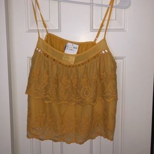 Ruffled, mustard blouse with spaghetti straps